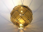 Tabletop LED Lighted Amber Japanese Glass Ball Fishing Float with Brown Netting Decoration 10"
