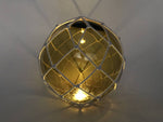 Tabletop LED Lighted Amber Japanese Glass Ball Fishing Float with White Netting Decoration 10"