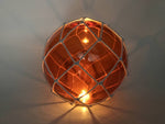 Tabletop LED Lighted Orange Japanese Glass Ball Fishing Float with White Netting Decoration 10"