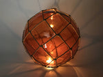 Tabletop LED Lighted Orange Japanese Glass Ball Fishing Float with Brown Netting Decoration 10"