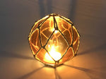 Tabletop LED Lighted Orange Japanese Glass Ball Fishing Float with Brown Netting Decoration 4"